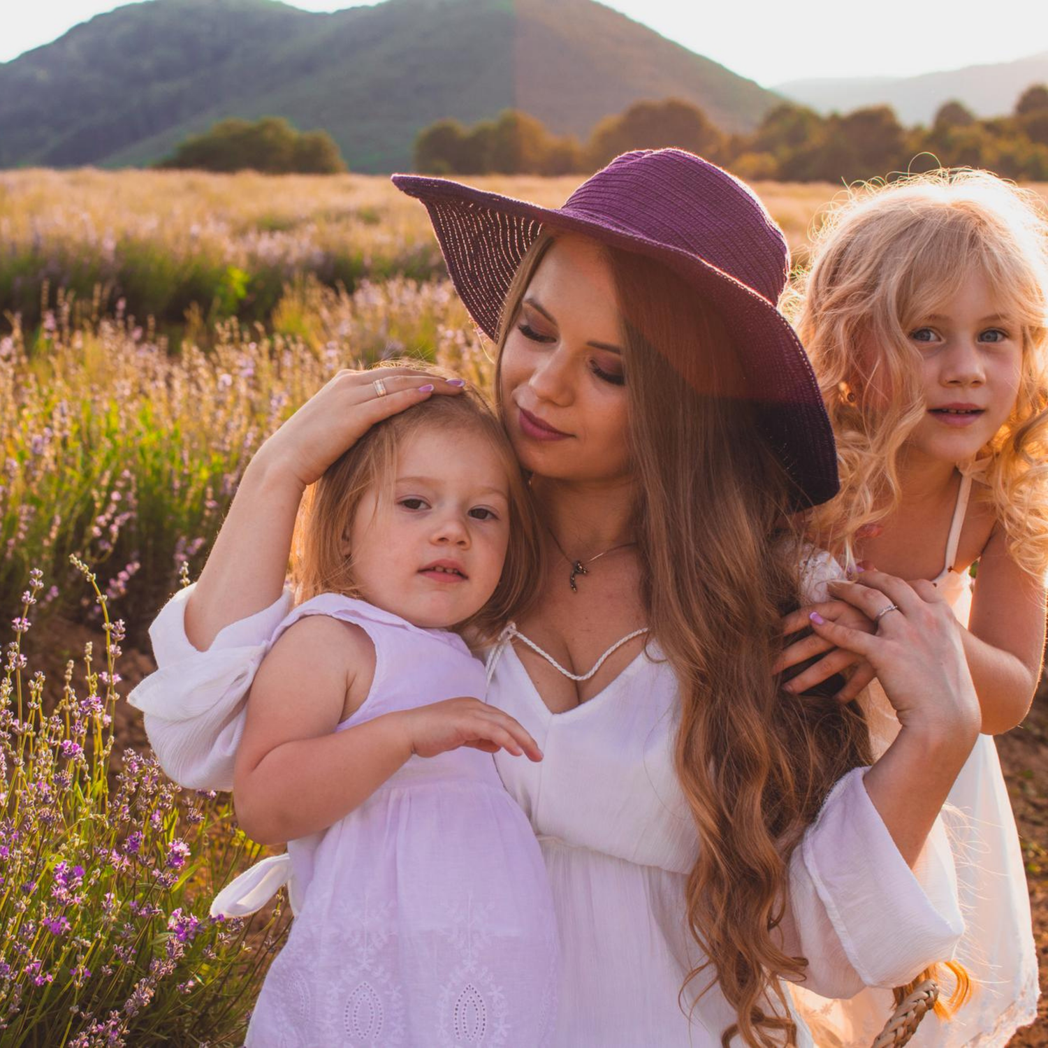A mother and her daughters in a botanical field, representing Fiorley’s non-toxic and family-safe hair care formulated without endocrine disruptors or phenoxyethanol.